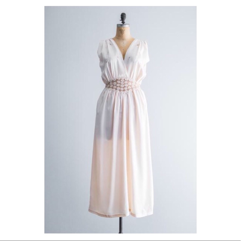 1940s light pink rayon slip with waist cut-out.